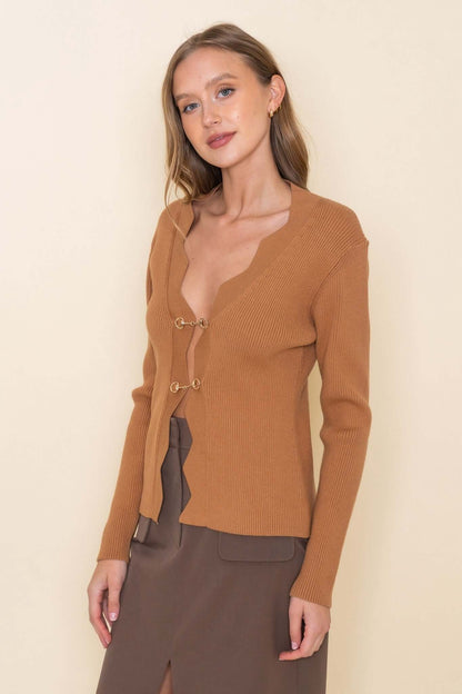 Gold horsebit cardigan by Fore Collection featuring a classic knit design and elegant gold horsebit detail on the front.
