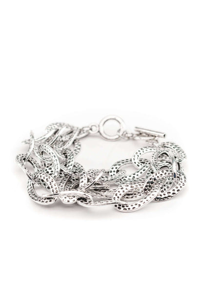 Hammered silver three-strand chain toggle bracelet from West & Co. featuring textured silver links and a toggle clasp.