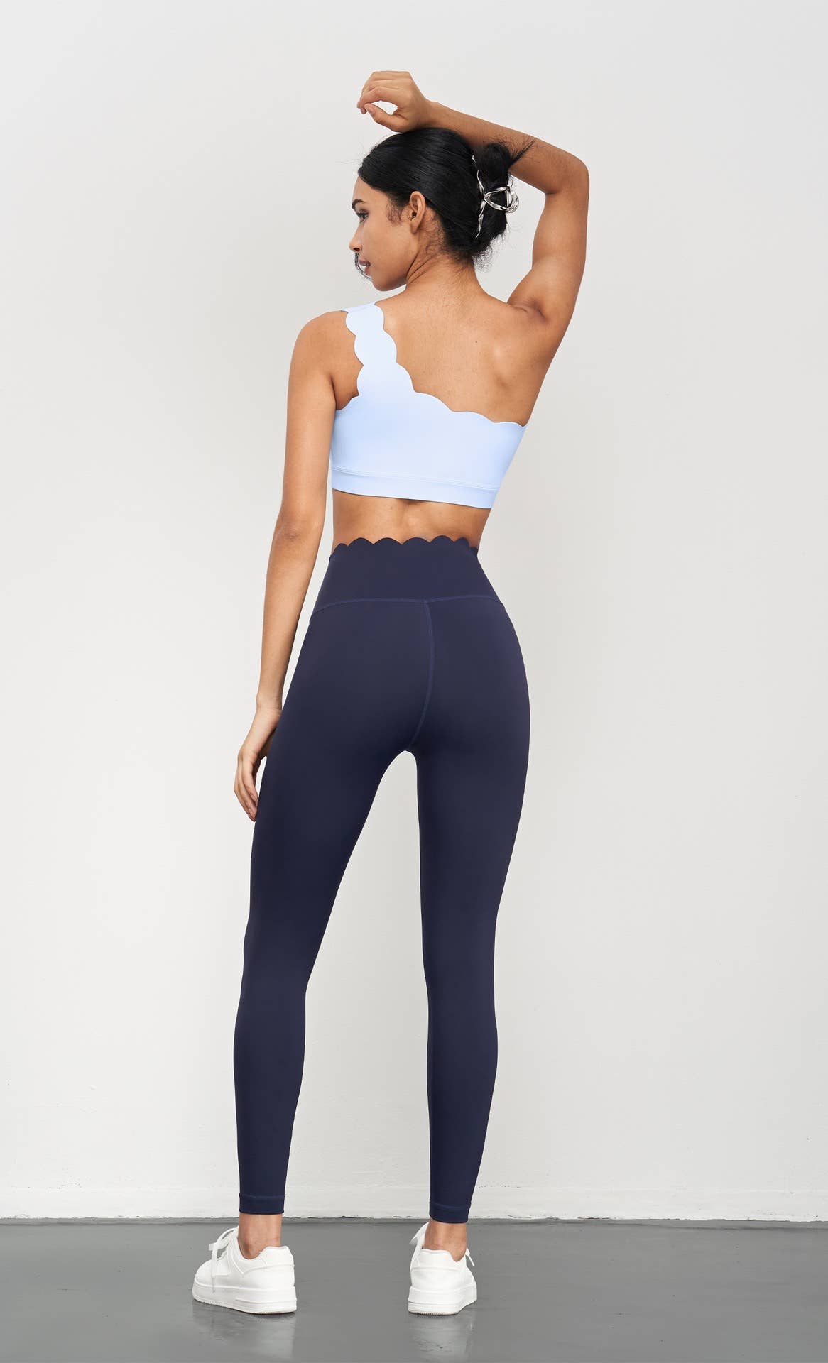 Helena Scallop One Shoulder Sports Bra by 91thelabel, activewear with scallop design, one-shoulder style, in black fabric.