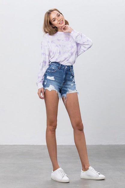 Insane Gene high-rise distressed denim shorts with raw hem, showcasing frayed edges and casual summer style.