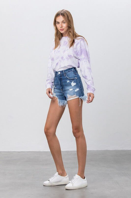 High-rise distressed denim shorts with raw hem from Insane Gene, showcasing a casual, trendy summer look.