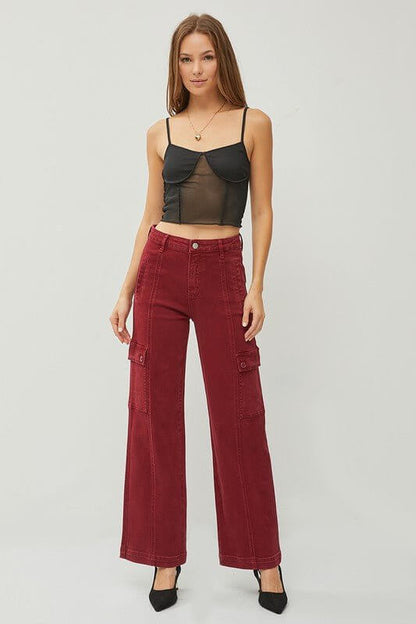 Risen high-rise wide cargo pants featuring multiple pockets, relaxed fit, and durable fabric in a casual streetwear style.