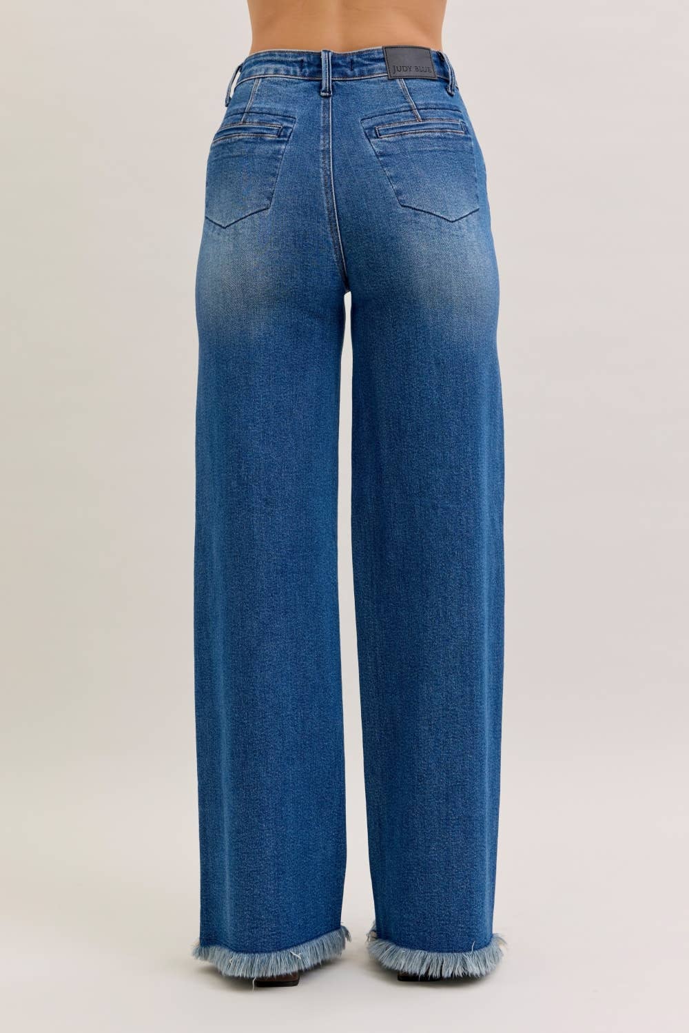 High rise Judy Blue column straight jeans with button fly and back welt pockets, showcasing a classic denim style.