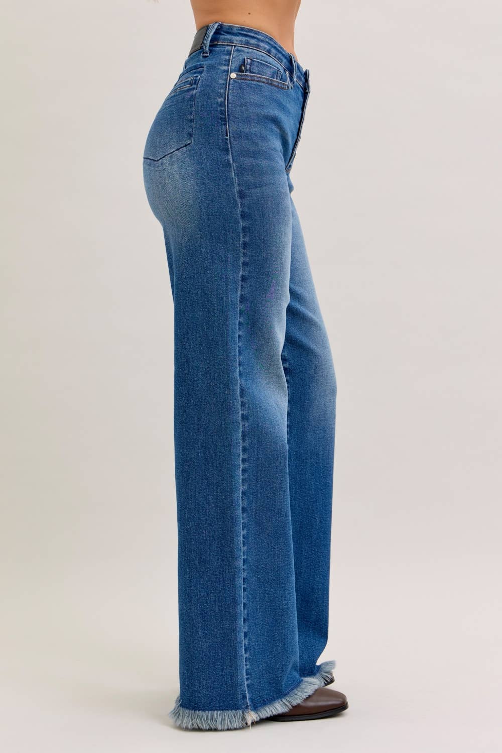 High rise Judy Blue straight column jeans with button fly and back welt pockets, showcasing a classic denim fit and style.