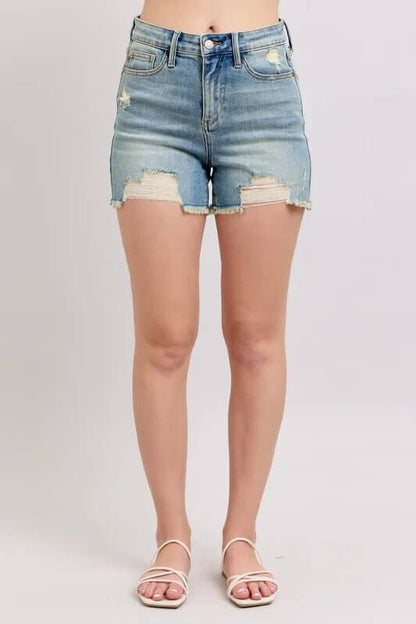 Judy Blue high-rise washed denim shorts with fly stitch detail and distressed, destroyed design, front view showing frayed hem.