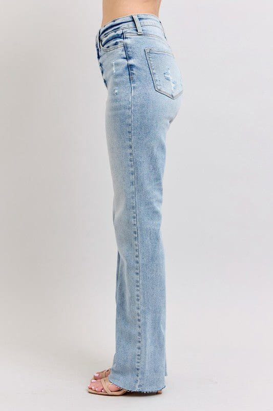 Light wash Judy Blue high waist dad jeans with relaxed fit and classic denim style, shown on a model.