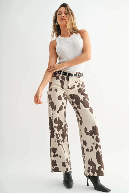 JBD Just Black Denim cow print wide leg jeans showing black denim fabric with cow pattern and relaxed fit.