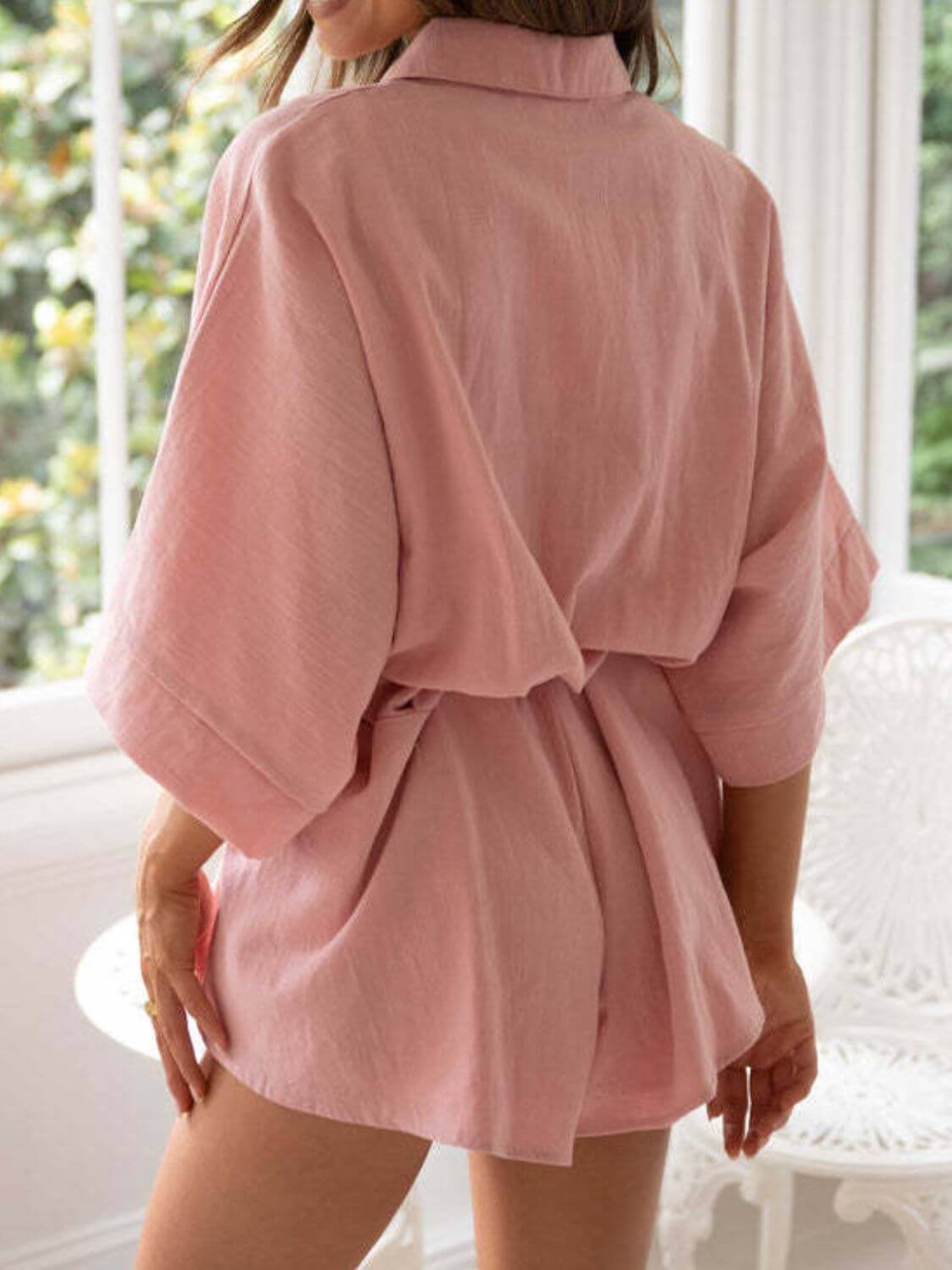 Kim Caven Cowgirl Charm belted romper set with collared neck, half sleeves, pink and white casual chic jumpsuit.
