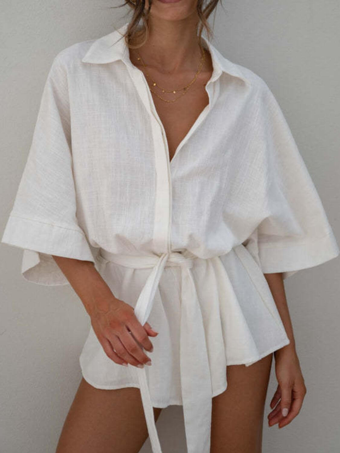 Cowgirl Charm Kim Caven pink and white collared neck belted romper set with half sleeves, casual chic style.