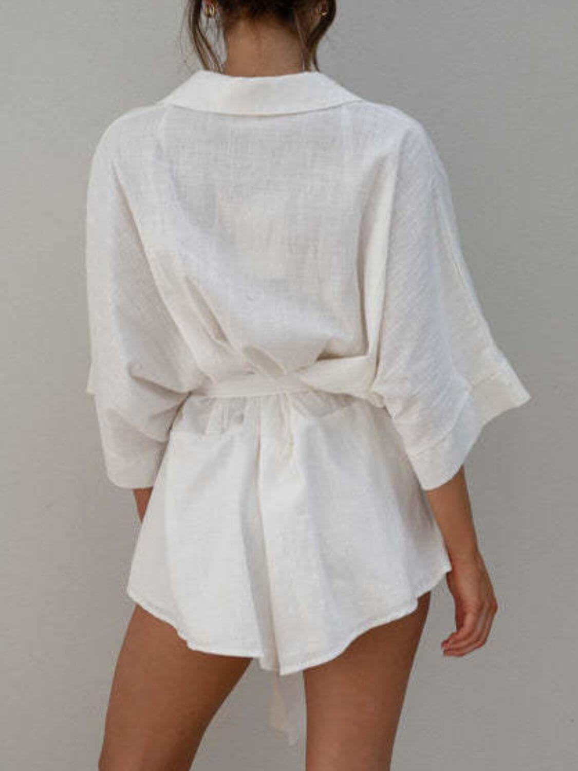 Kim Caven belted collared neck romper set by Cowgirl Charm featuring half sleeves in pink and white, casual chic style.
