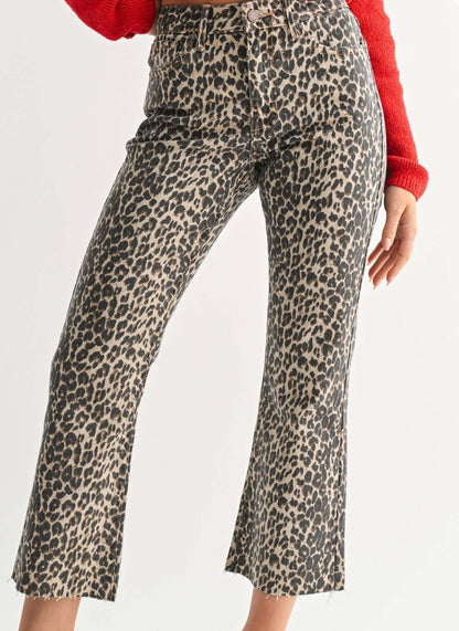JBD Just Black Denim leopard print distressed hem jeans, stylish bottoms with ripped details and bold animal print design.
