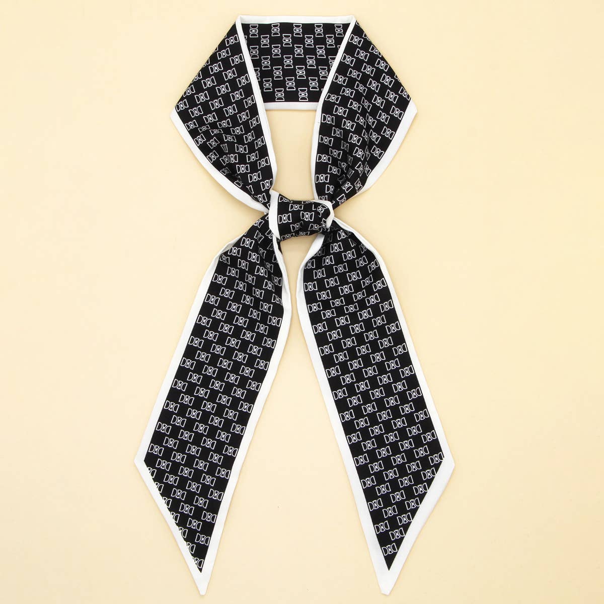 ACCITY Letter Floral Twilly Scarf used as hair ribbon and bag tie, featuring vibrant floral and letter patterns.