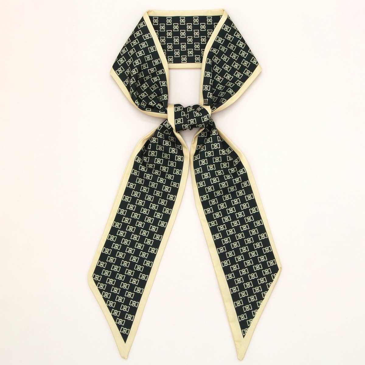 ACCITY Letter Floral Twilly Scarf used as a hair ribbon and bag tie, featuring vibrant floral and letter pattern.