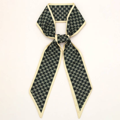 ACCITY Letter Floral Twilly Scarf used as a hair ribbon and bag tie, featuring vibrant floral and letter pattern.