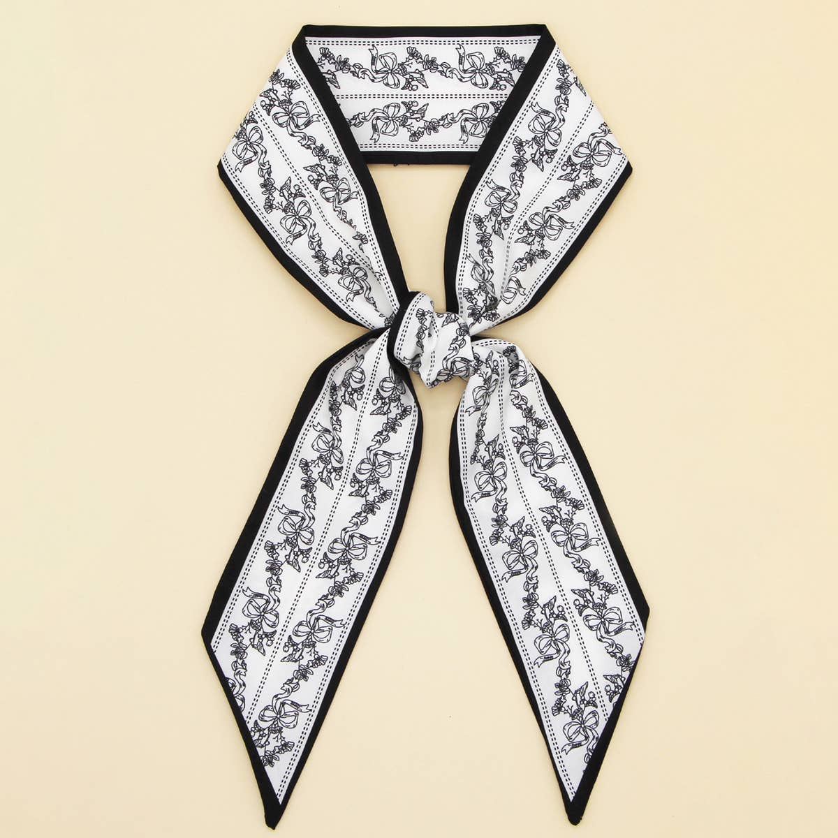 ACCITY Letter Floral Twilly Scarf used as hair ribbon and bag tie, featuring vibrant floral and letter pattern.