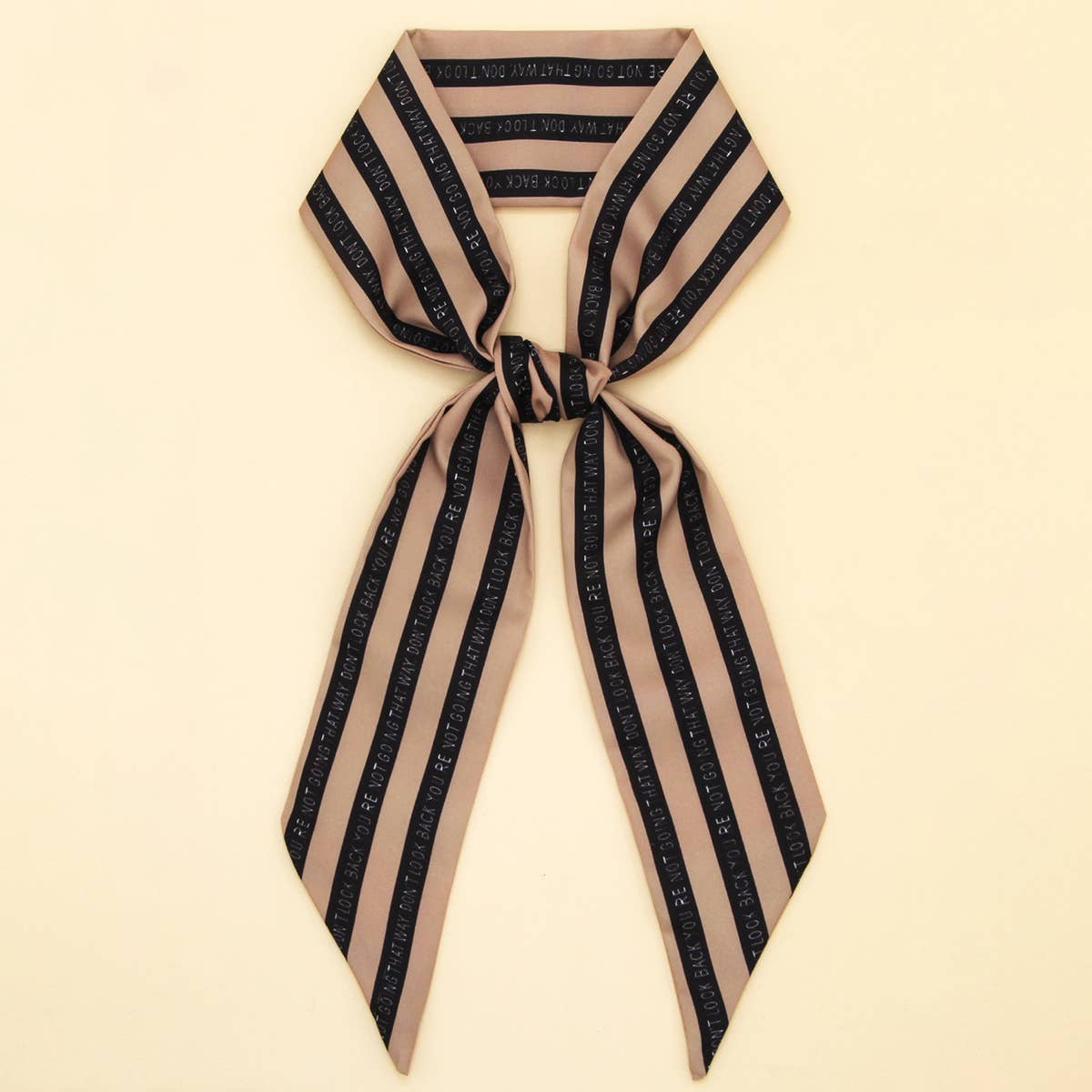 ACCITY Letter Floral Twilly Scarf used as hair ribbon and bag tie, featuring vibrant floral and letter patterns.