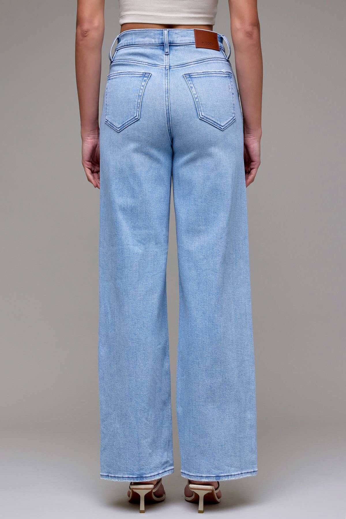 Light wash distressed dad jeans by Hidden Jeans with 33-inch inseam, featuring a relaxed fit and casual distressed detailing.