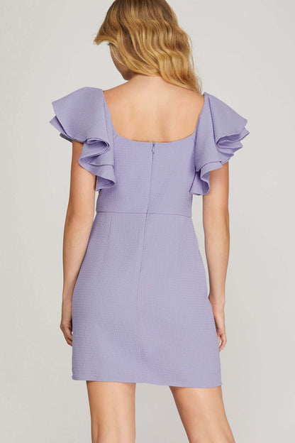 Lilac She and Sky mini dress with double ruffle sleeves, textured fabric, square neckline, and fit-and-flare silhouette.