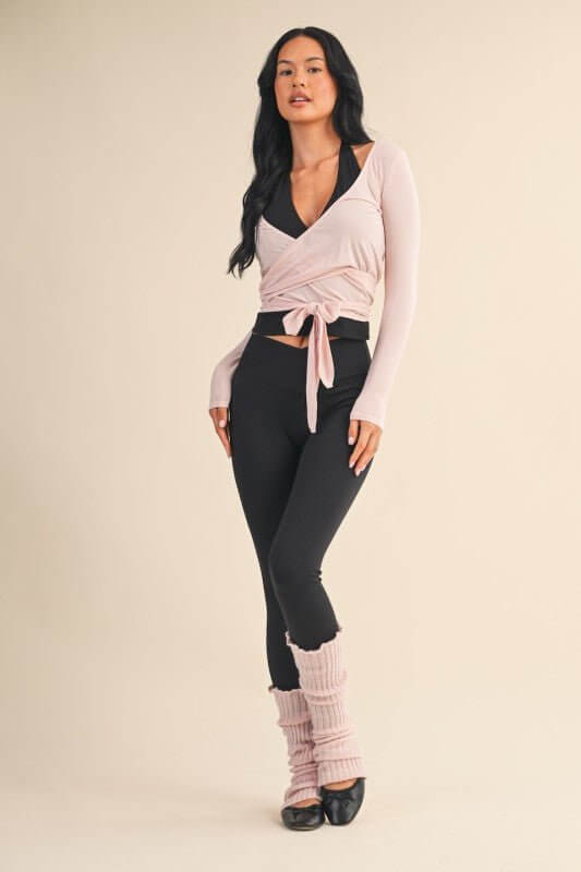 Kimberly C long sleeve V-neck wrap top, activewear style, shown in a comfortable fit with a stylish V-neck and wrap design.