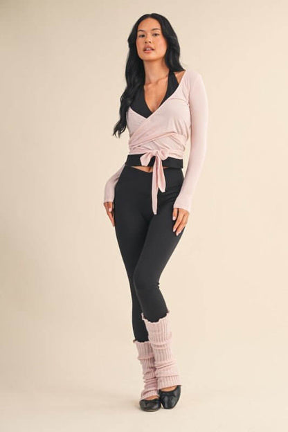 Kimberly C long sleeve V-neck wrap top, activewear style, shown in a comfortable fit with a stylish V-neck and wrap design.
