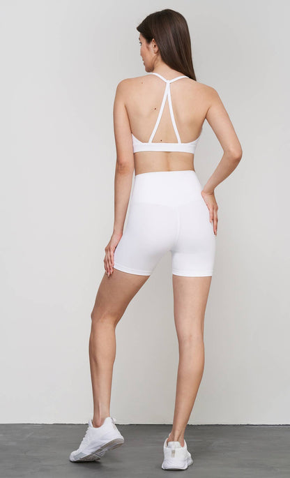 Luna 2-piece sports bra and shorts yoga set by 91thelabel, ideal for Pilates and workout sessions, shown on a model.