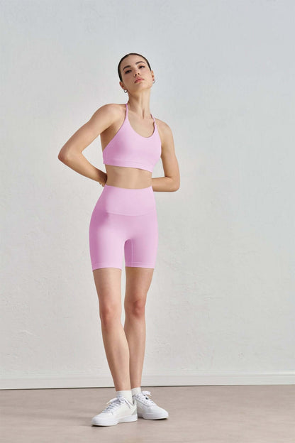 Luna 2-piece sports bra and shorts yoga set by 91thelabel, ideal for Pilates and workout sessions, shown on a model.