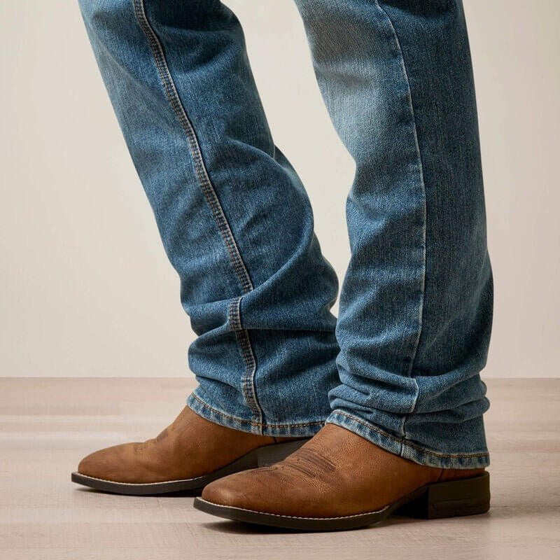 Ariat M5 Straight Hansen jeans in classic denim, showing the fit and style of the men's straight-leg denim bottoms.
