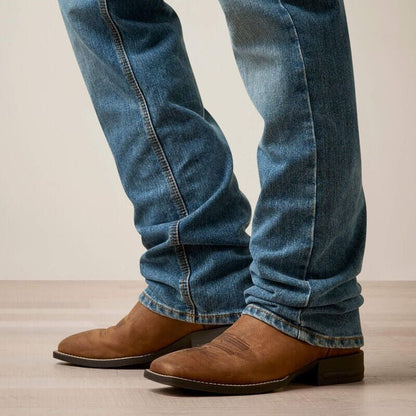 Ariat M5 Straight Hansen jeans in classic denim, showing the fit and style of the men's straight-leg denim bottoms.