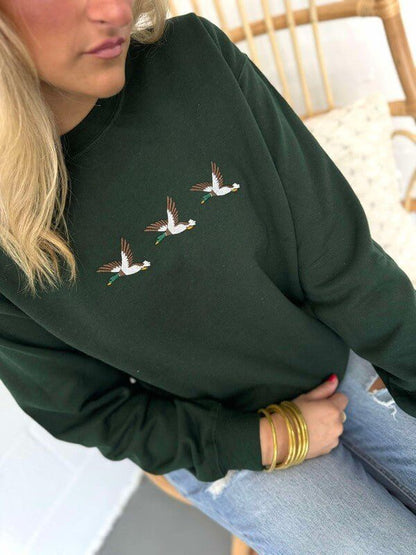 Gray embroidered sweatshirt featuring a mallard duck graphic from Dash Forward Wholesale, casual and cozy apparel.