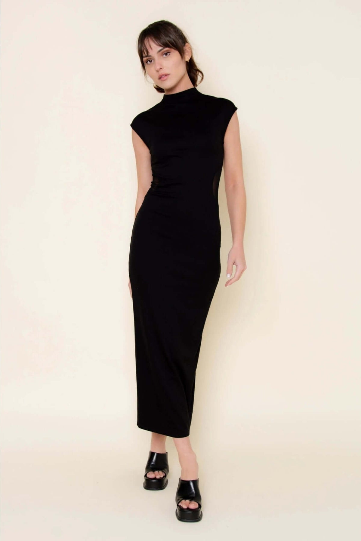Fore Collection mesh side slit maxi dress showing a flowing fabric with a high slit and elegant design.