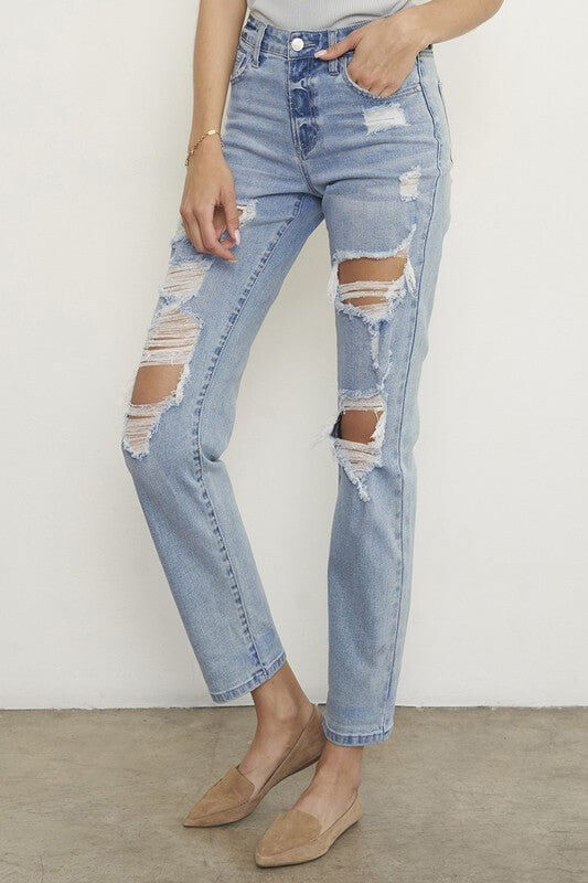 Light wash mid-waisted distressed boyfriend straight-leg jeans for women by Insane Gene, featuring ripped denim and casual style.