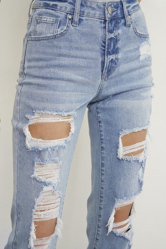 Light wash distressed boyfriend straight-leg jeans for women by Insane Gene, showing mid-waist fit and ripped denim details.