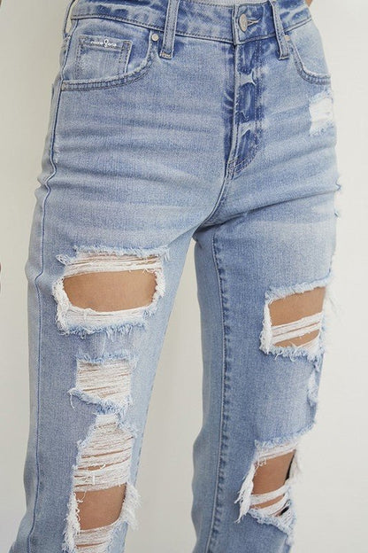 Light wash distressed boyfriend straight-leg jeans for women by Insane Gene, showing mid-waist fit and ripped denim details.