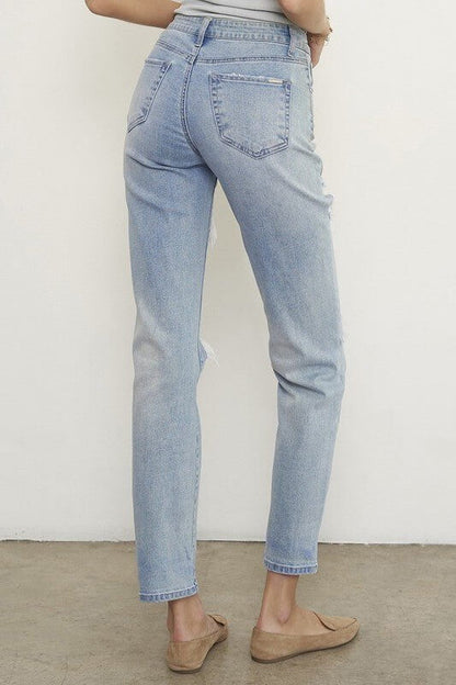 Light wash distressed boyfriend straight-leg jeans for women by Insane Gene, mid-waisted with ripped denim detailing.