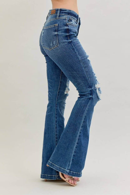 Distressed Judy Blue midrise button fly flare jeans with distressed details and classic denim style, designed for a trendy casual look.