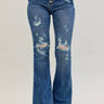 Distressed Judy Blue midrise button fly flare trousers with a relaxed fit and faded denim finish.