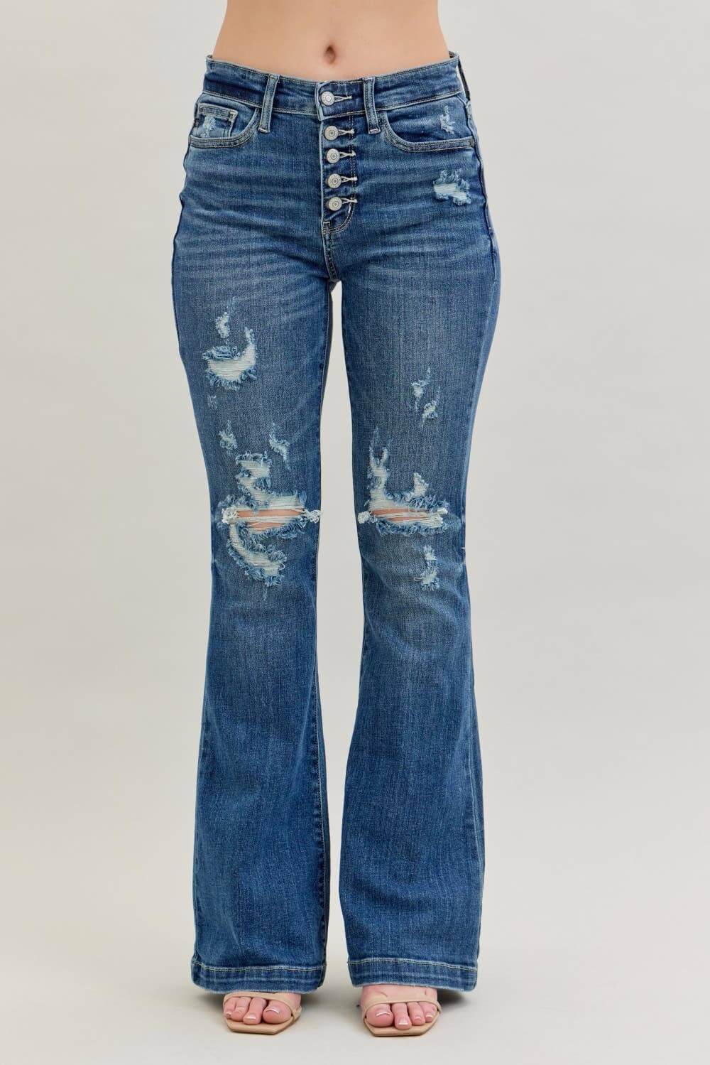 Midrise Judy Blue distressed flare jeans with button fly and distressed details, showcasing a stylish denim bottom for casual wear.