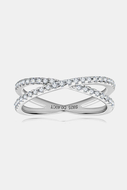 Sterling silver moissanite crisscross ring with infinity design and 0.40 CT sparkling stones, elegant jewelry accessory.