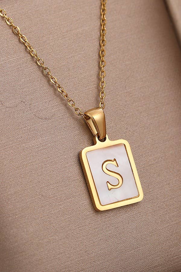 JOSSLYN by wall to wall stainless steel initial tarnish-free necklace with a sleek, polished pendant on a chain.