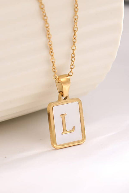 Stainless steel tarnish-free initial necklace from JOSSLYN by Wall to Wall, featuring a sleek, minimalist pendant on a delicate chain.