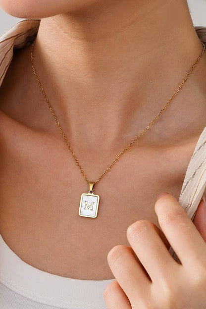 Stainless steel tarnish-free necklace with initial pendant by JOSSLYN, stylish jewelry accessory for everyday wear.
