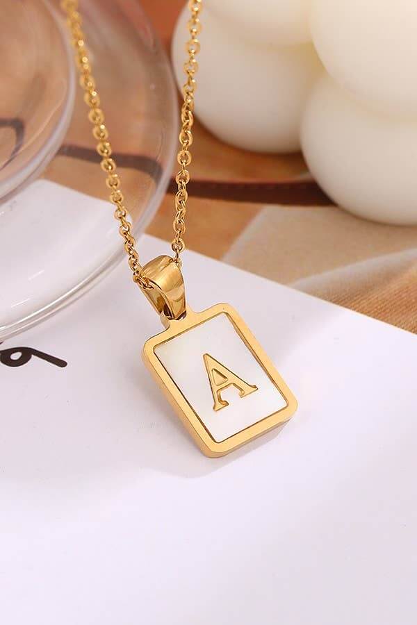 Stainless steel initial necklace by JOSSLYN featuring a tarnish-free design, showcasing a close-up of the personalized jewelry piece.