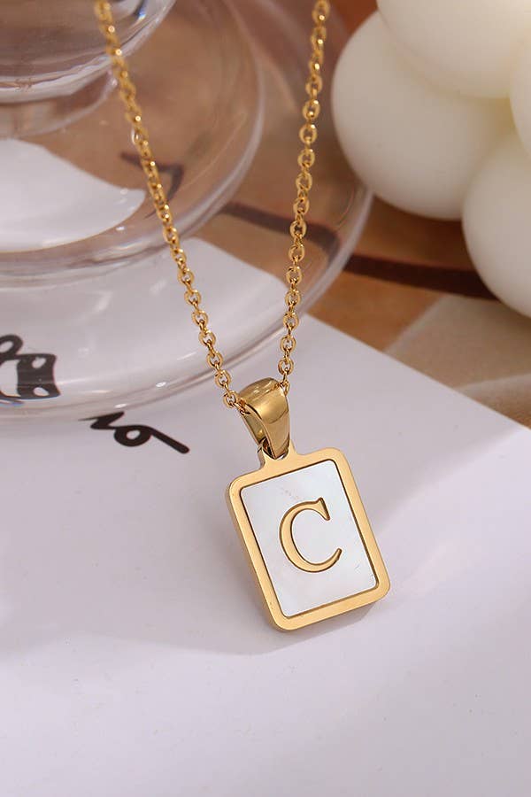 Initial stainless steel tarnish-free necklace by JOSSLYN, elegant jewelry accessory with a polished finish and minimalist design.