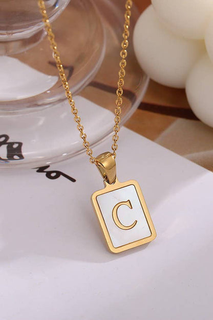 Initial stainless steel tarnish-free necklace by JOSSLYN, elegant jewelry accessory with a polished finish and minimalist design.