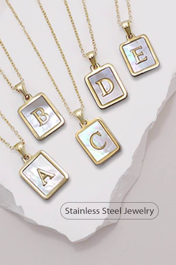 Stylish stainless steel initial necklace by JOSSLYN, tarnish-free jewelry accessory with a sleek, modern design.