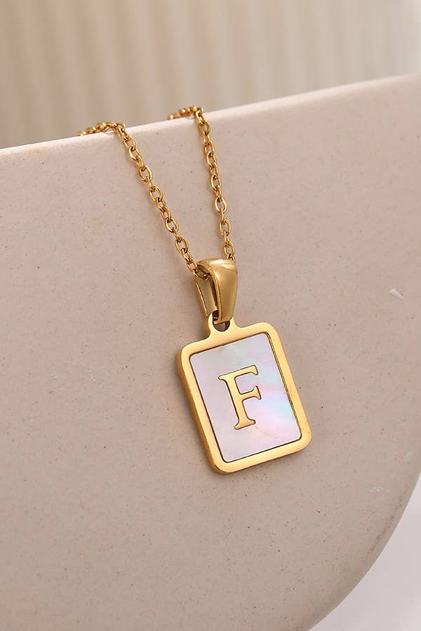 JOSSLYN by Wall to Wall stainless steel initial tarnish-free necklace, close-up view of sleek, minimalist jewelry accessory.