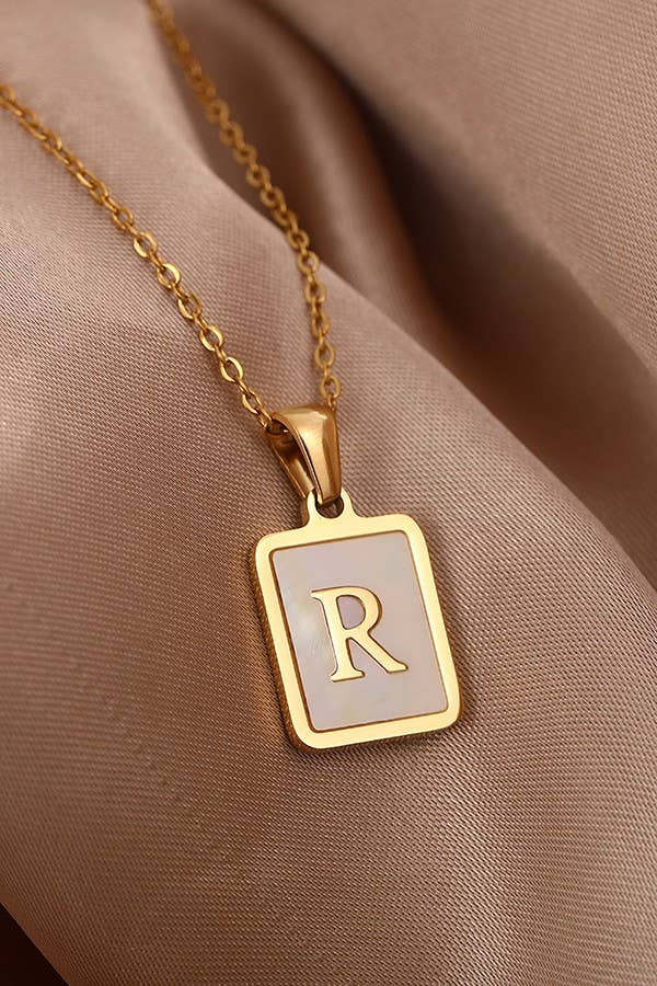 Initial stainless steel tarnish-free necklace by JOSSLYN, featuring a sleek, polished jewelry accessory for everyday wear.