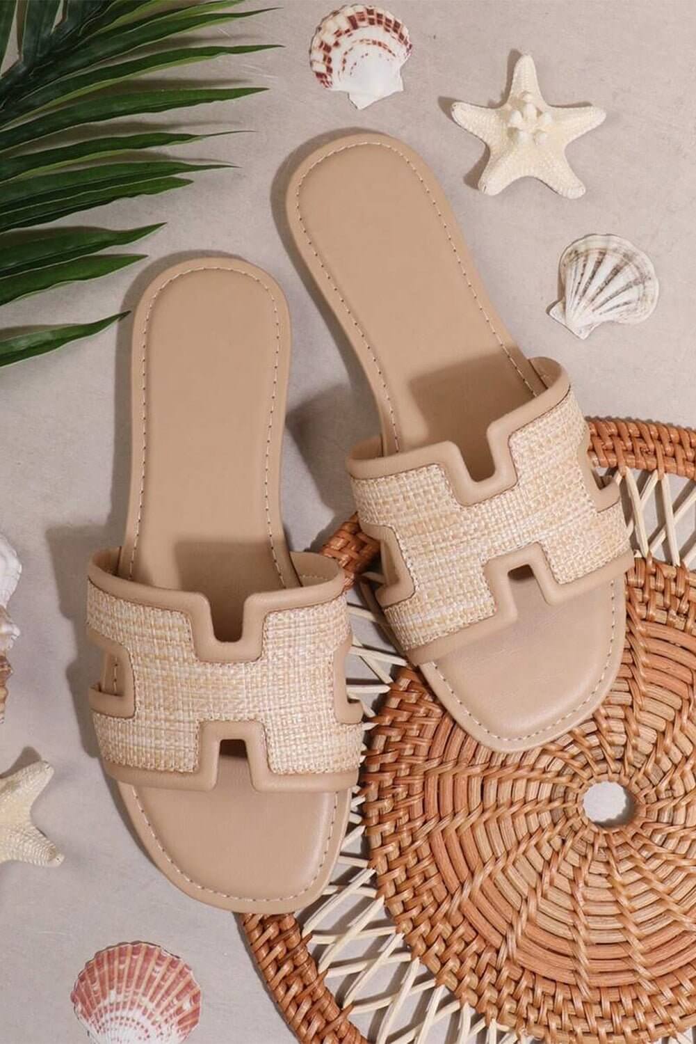 Natural woven slide sandals by Cowgirl Charm, casual summer flats with open toe design and comfortable slip-on style.