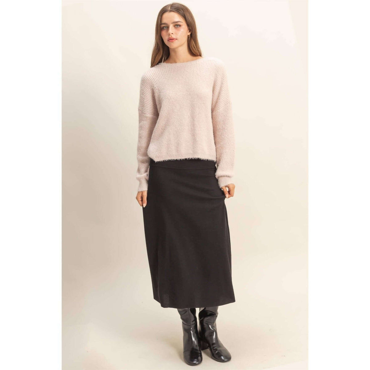 HYFVE oversized fuzzy sweater with back twist detail, cozy knit, long sleeves, and relaxed fit for casual wear.