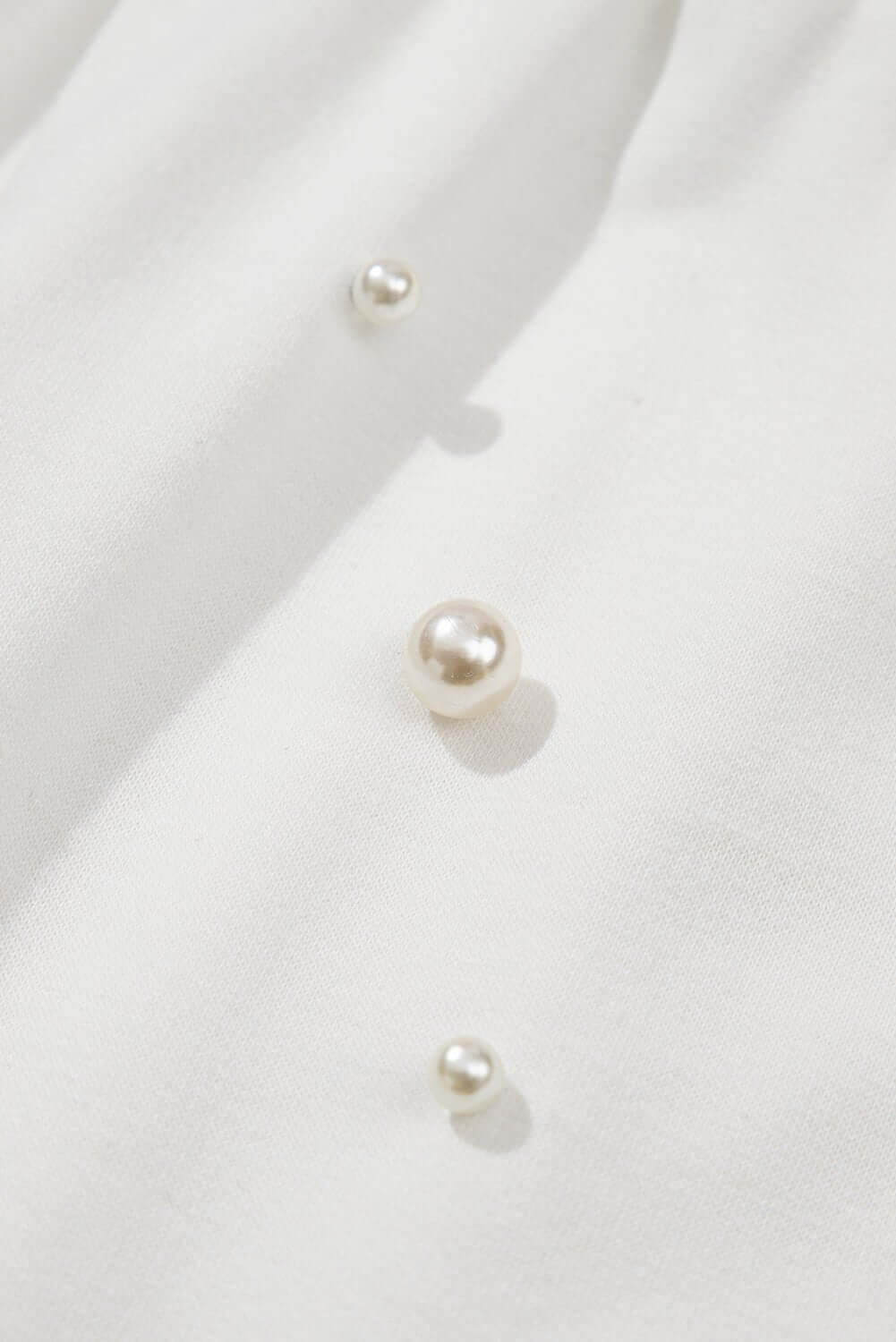 White embroidered Pearl Puff Sleeve Lounge Set by Cowgirl Charm, two-piece casual outfit with puff sleeves and relaxed fit.